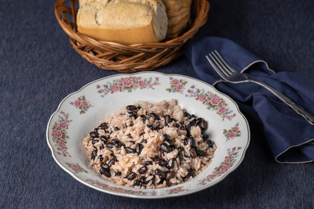 Gallo pinto, traditional Costa Rican food on tablecloth.